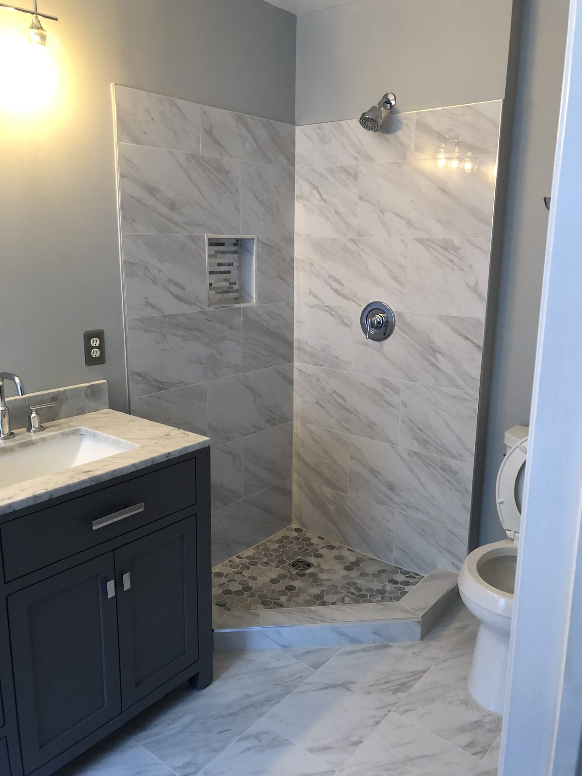 Marble tile shower and vanity bathroom remodel