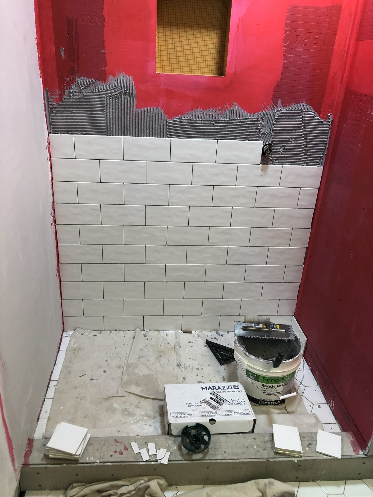 Subway tile installation in progress