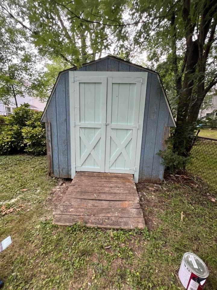 Restored shed doors painted and repaired