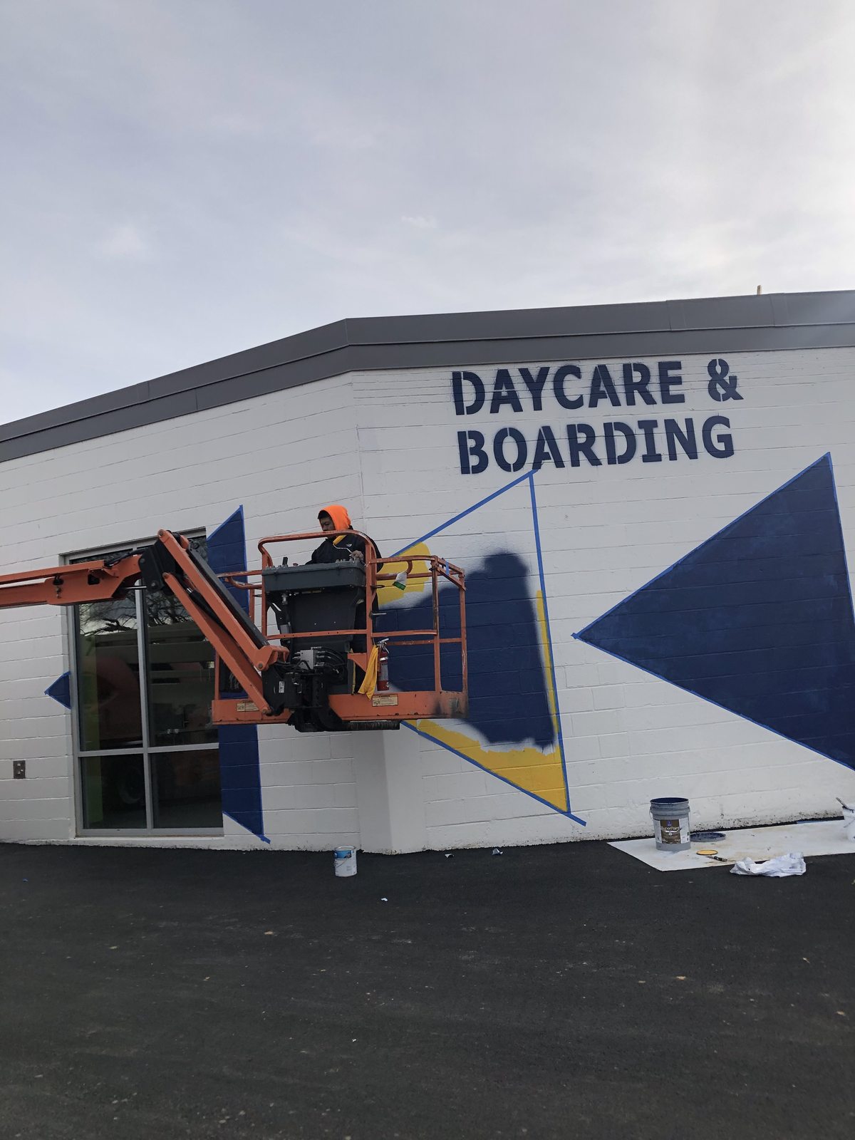 Commercial building exterior painting in progress