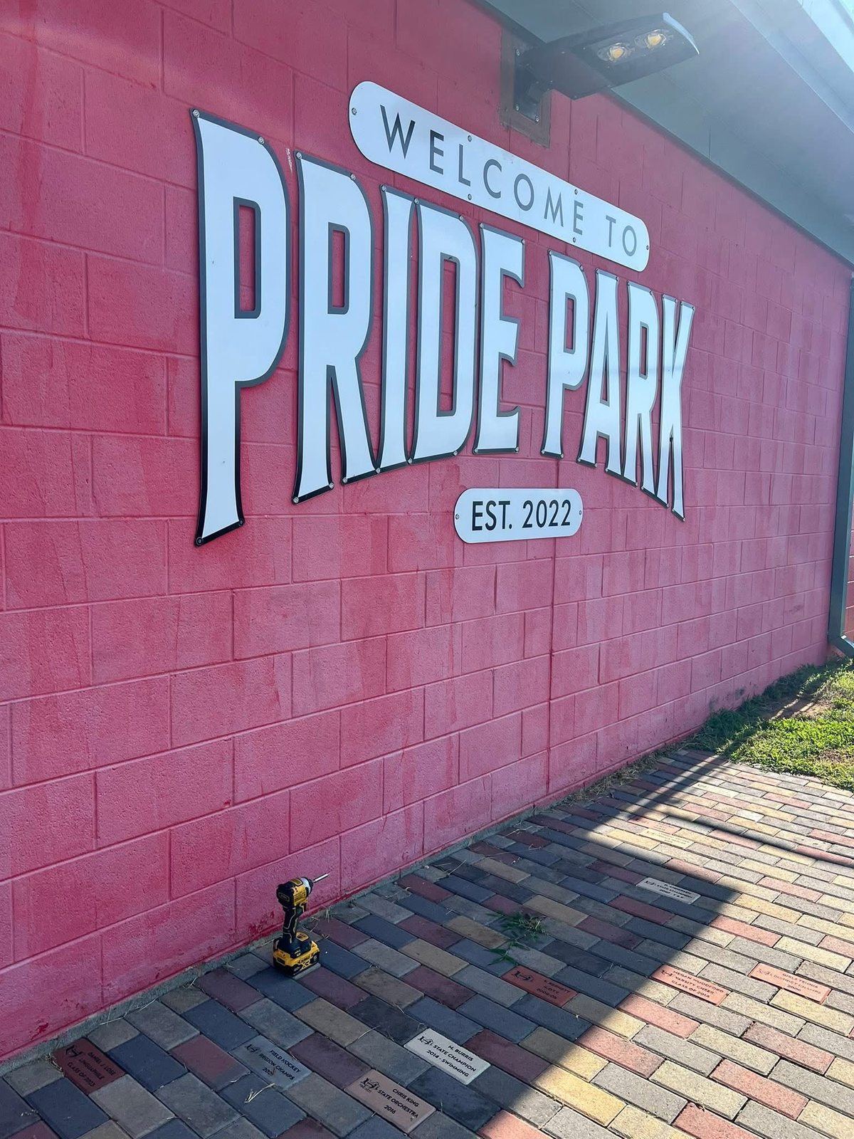 Community park block wall painted with signage