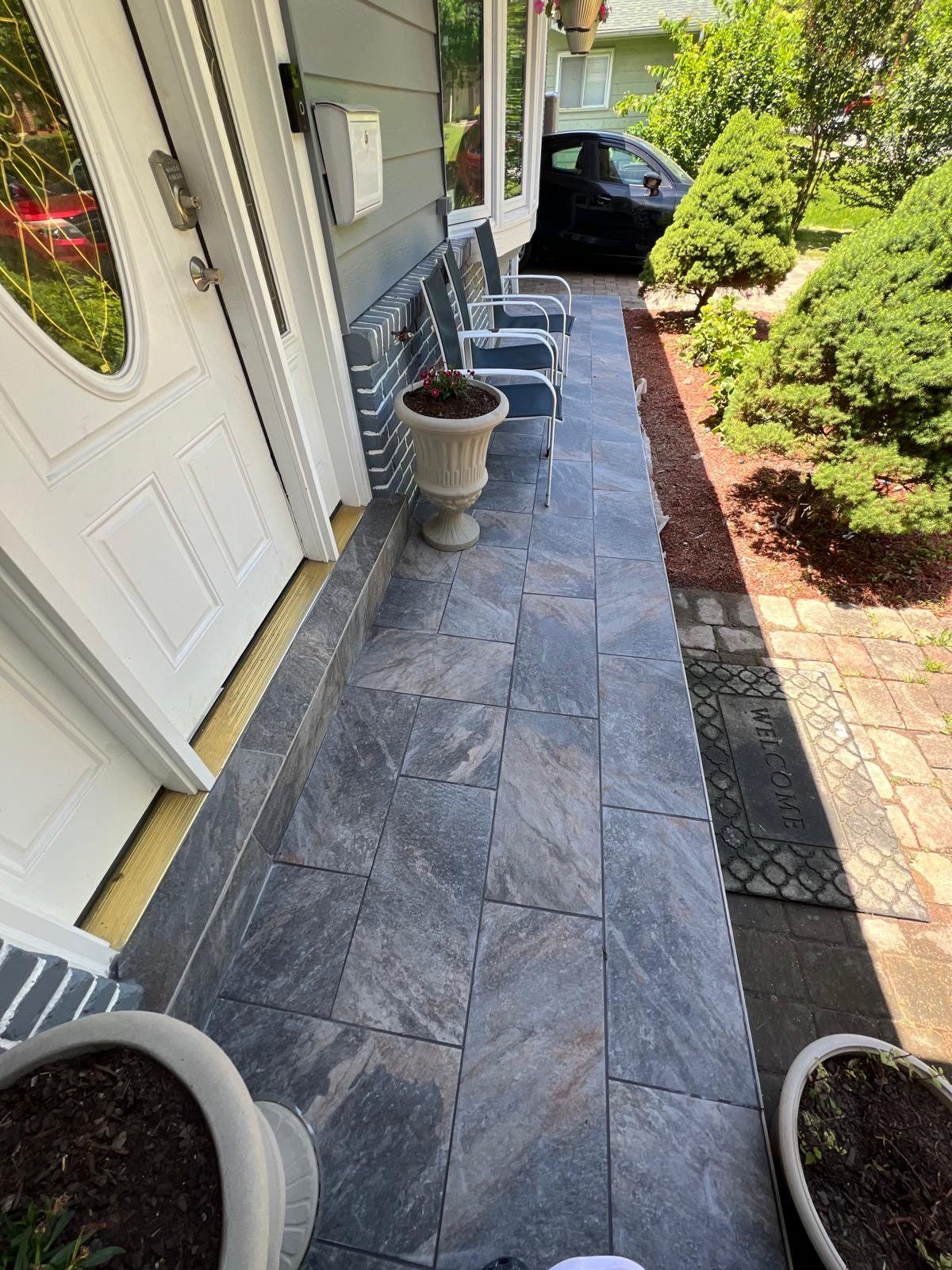 Stone tile walkway at front entry